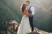 a gorgeous wedding portrait on top of the mountain is a fantastic idea for any couple
