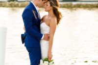 a super bold blue groom’s suit with a white shirt for a tropical beach wedding