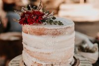 a textural naked wedding cake with fresh blooms on top is a yummy and chic idea for a wedding