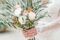 a wedding bouquet of olive branches, white blooms, berries is a bold and creative idea for a modern bride