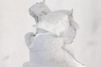 a white textural wedding cake with a melting effect is a very statement idea that wows