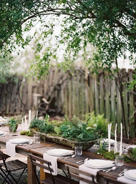 an antique wooden bowl with greenery for a relaxed woodland-inspired wedding