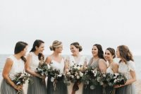 beautiful coastal bridesmaid looks with mismatching white plain and alce tops and matching grey tulle maxi skirts are dreamy and chic