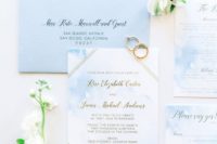 beautiful light blue and white wedding stationery with gold touches is a chic idea for a beach wedding
