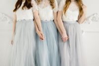 chic bridesmaid looks with white lace crop tops with illusion necklines and grey and blue tulle maxi skirts