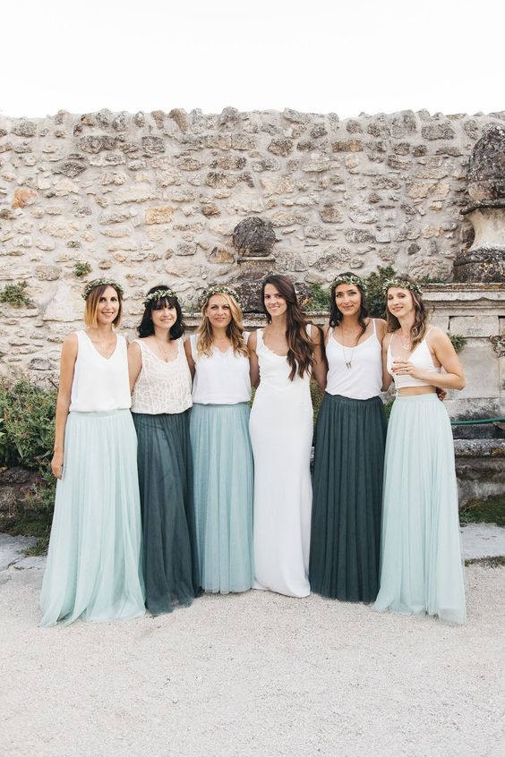 delicate spring bridesmaid looks with mismatching white lace and plain tops and crop tops and dark green and light aqua pleated tulle skirts plus floral crowns