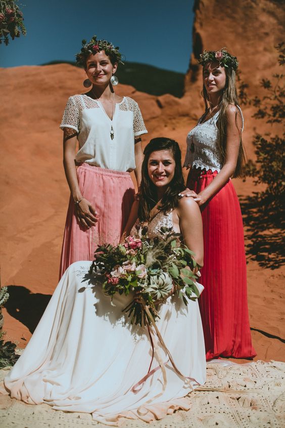 mismatching boho lace tops and a pink and a coral baxi skirt for a boho chic and bold wedding in the desert