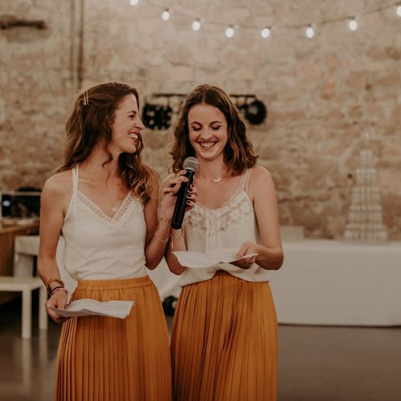mismatching lace spraghetti strap tops and mellow yellow pleated maxi skirts for a relaxed boho wedding