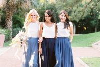 mismatching white plain tops and blue, royal blue and navy flowy maxi skirts for a relaxed summer wedding by the sea