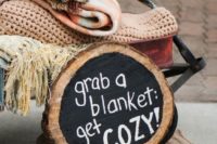 provide your guests with blankets and add a cool sign to mark the storage space