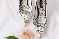 white wedding shoes with black edges, with colorful graffiti are a super creative and unique wedding solution to stand out