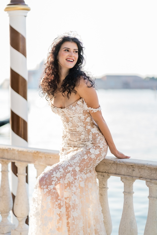a beautiful nude off the shoulder wedding dress with white floral applique and embellishments is a fantastic idea for a Venice wedding