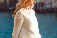a bridal separate with a warm white top with crochet lace and a layered skirt
