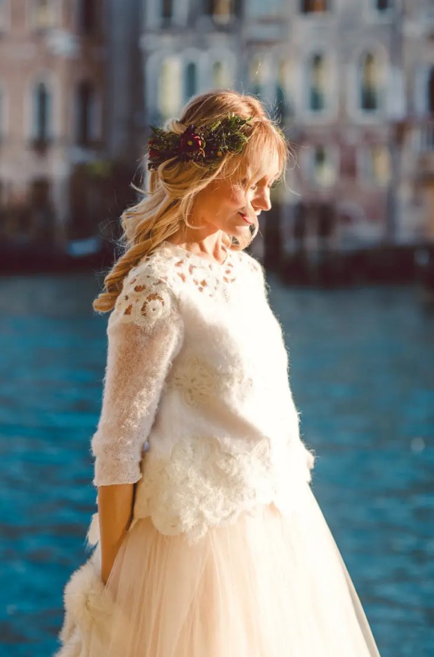 a bridal separate with a warm white top with crochet lace and a layered skirt