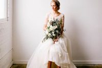 a charming high low wedding dress with a lace bodice with short sleeves and a layered tulle high low skirt plus nude shoes