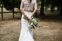 a chic bridal separate with a lace crop top on buttons and a mermaid lace skirt with a train