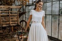a chic bridal separate with a lace crop top with short sleeves and a pleated high low maxi skirt
