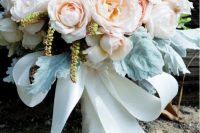 a classic wedding bouquet with blush, pink and white blooms, pale foliage and a white silk ribbon bow is amazing