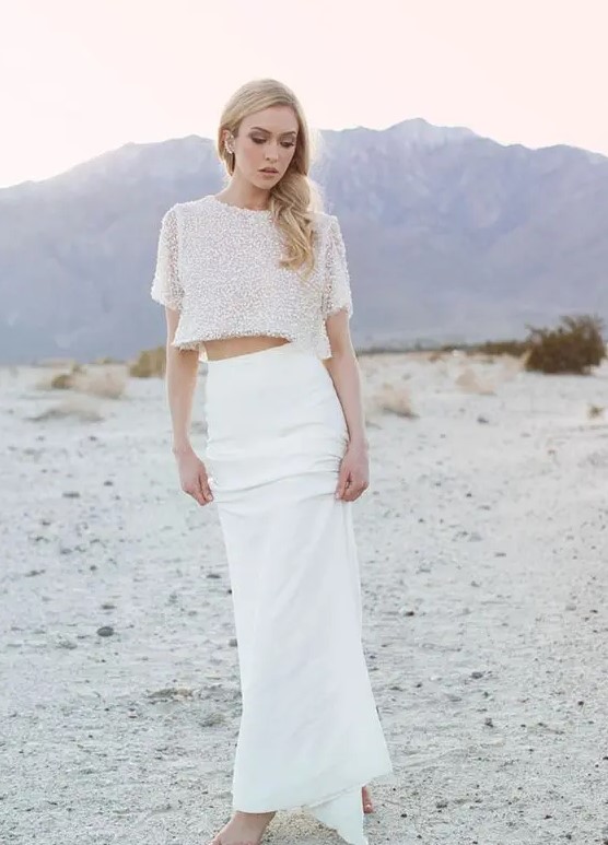 a fitting plain skirt and a sparkling short sleeve crop top are a perfect look for a modern and edgy wedding