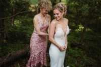 a gorgeous mermaid wedding dress with a lace embellished bodice with a plunging neckline, pearl straps and a plain skirt with a train