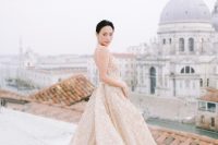 a jaw-dropping modern wedding ballgown with gold floral embroidery and beading plus spaghetti straps for a Venice wedding