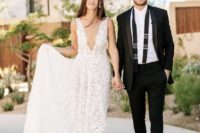 a lace thick strap wedding A-line wedding dress with a covered plunging neckline is a romantic idea