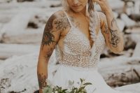 a lovely spaghetti strap A-line wedding dress with an embellished bodice and pleated skirt, straps that don’t prevent us from seeing gorgeous tattoos