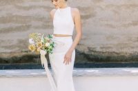 a minimalist, chic and sexy plain bridal separate with a halter neckline crop top and a mermaid skirt with a train is gorgeous