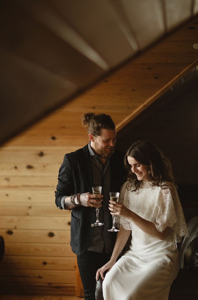 a minimalist wedding dress and a crochet cover up, a black suit and a grey shirt are lovely for a modern Icelandic wedding