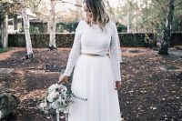 a modern and bold bridal separate with a white sequin crop top and long sleeves and a pleated white tulle maxi skirt