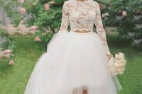 a pretty wedding separate with a lace crop top with long sleeves and a tulle layered high low skirt with a trian and blue Carrie Bradshow shoes
