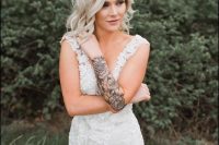 a gorgeous lace wedding dress is perfect for a tattooed bride