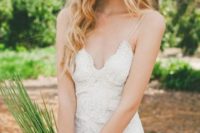 a sexy sheath slace wedding dress with spaghetti straps and a V-neckline looks super chic and gorgeous