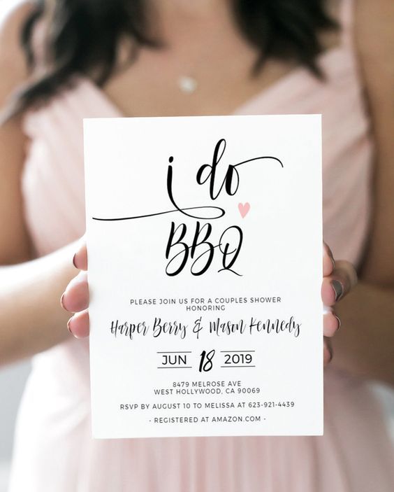a stylish and glam BBQ rehearsal invitation in black and white, with calligraphy and a pink heart