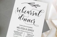 a stylish and simple black and white rehearsal dinner invitation with botanicals and a grey envelope