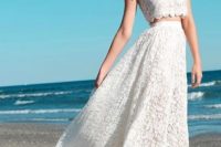 a two piece lace wedding dress with a cap sleeve crop top and an A-line high low skirt is very trendy