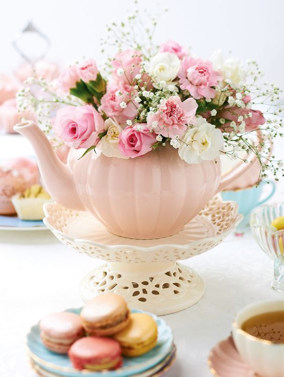 a vintage pink tea pot with fresh blooms on a stand will be a great party centerpiece