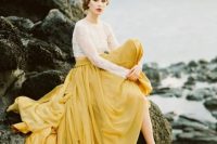 a white lace crop top and a yellow full skirt with a train to make a gorgeous color statement at the wedding