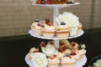 a white scallop edge wedding dessert stand is a great option for a modern or vintage wedding
