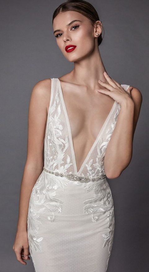 a wide strap lace heavily embellished sheath wedding dress with a plunging neckline