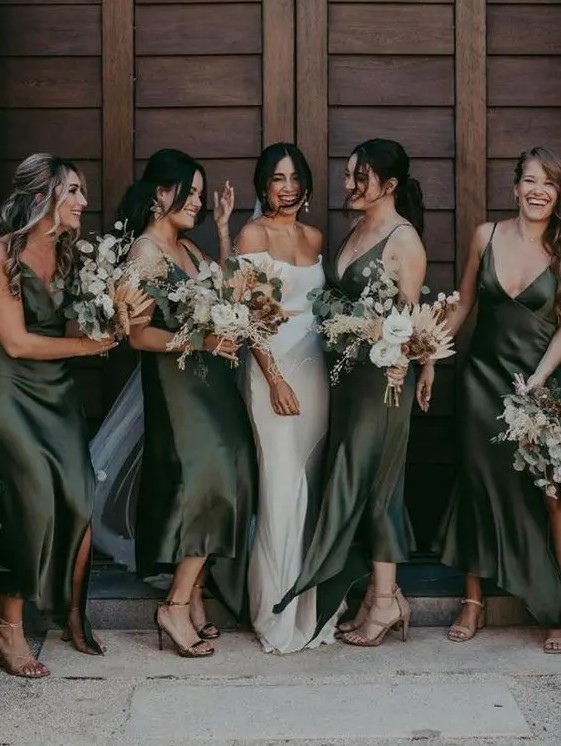 beautiful green slip silk bridesmaid dresses with asymmetrical skirts and deep V-necklines plus slits are amazing for fall weddings