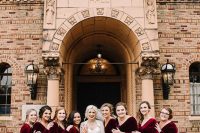 bold and chic burgundy velvet maxi bridesmaid dresses with V-necklines and long sleeves for a fall or winter wedding