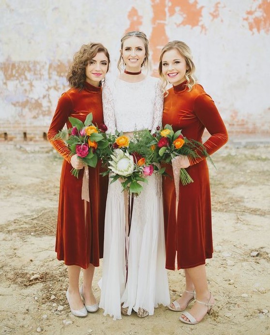 bold rust-colored velvet midi bridesmaid dresses with turtlenecks and long sleeves look statement-like and perfect for a fall wedding