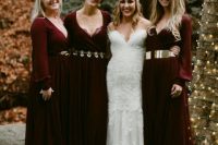 burgundy maxi dresses with long sleeves and different metallic belts for a fairy-tale inspired wedding