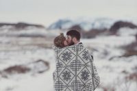 cover up with a lovely Icelandic blanket together while taking photos at your wedding