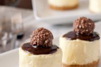 creamy no bake cheesecakes with some chocolate and Ferrero Roche on top