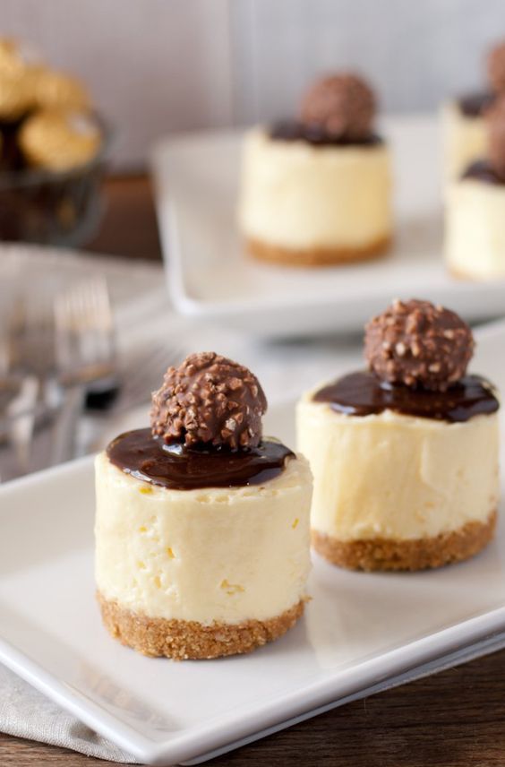 creamy no bake cheesecakes with some chocolate and Ferrero Roche on top