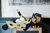fun gold glitter and chalkboard props – masks, moustaches, bottles, glasses and more for a NYE wedding