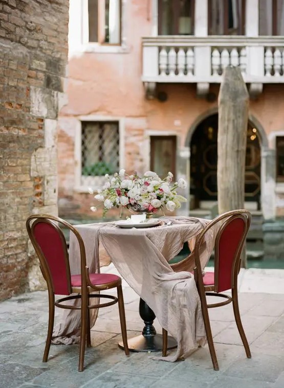 have a romantic dinner right on a porch in Venice to enjoy the looks of the ancient city