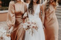 lovely peachy mismatching bridesmaid dresses with long sleeves and no sleeves, a slit and a deep neckline